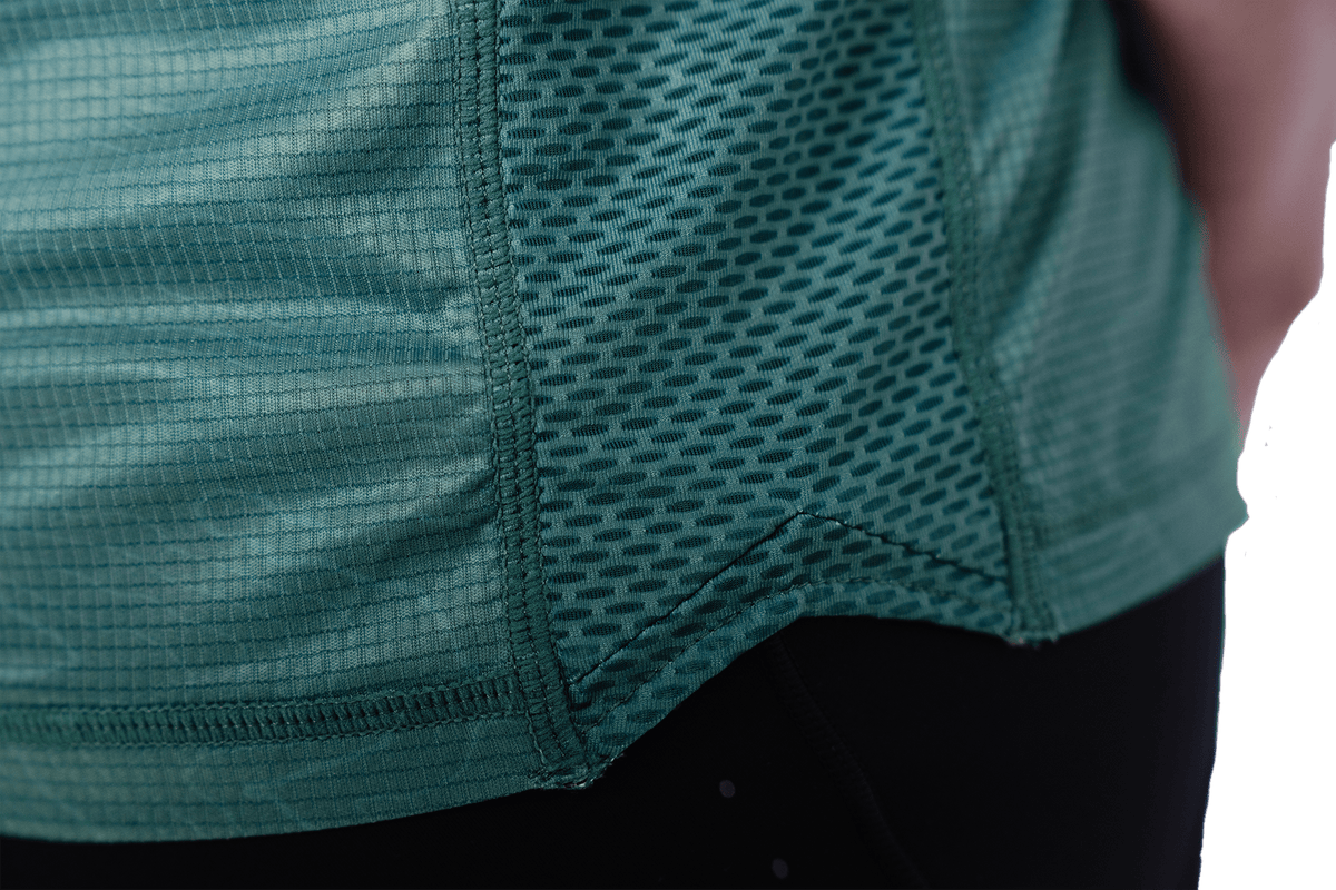 Close-up of a green athletic shirt with mesh design