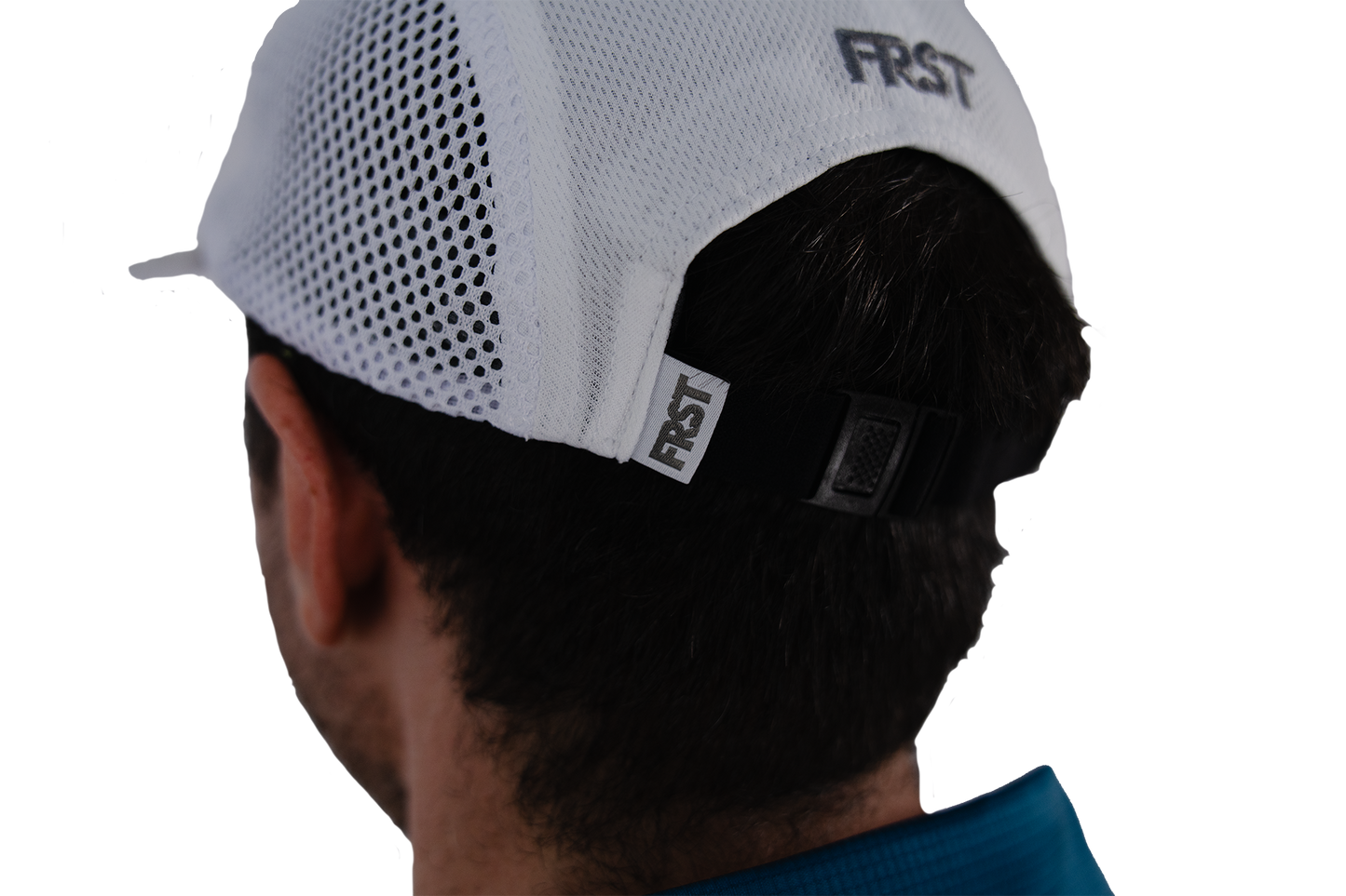 Person wearing a white cap with 'FIRST' branding on a white background