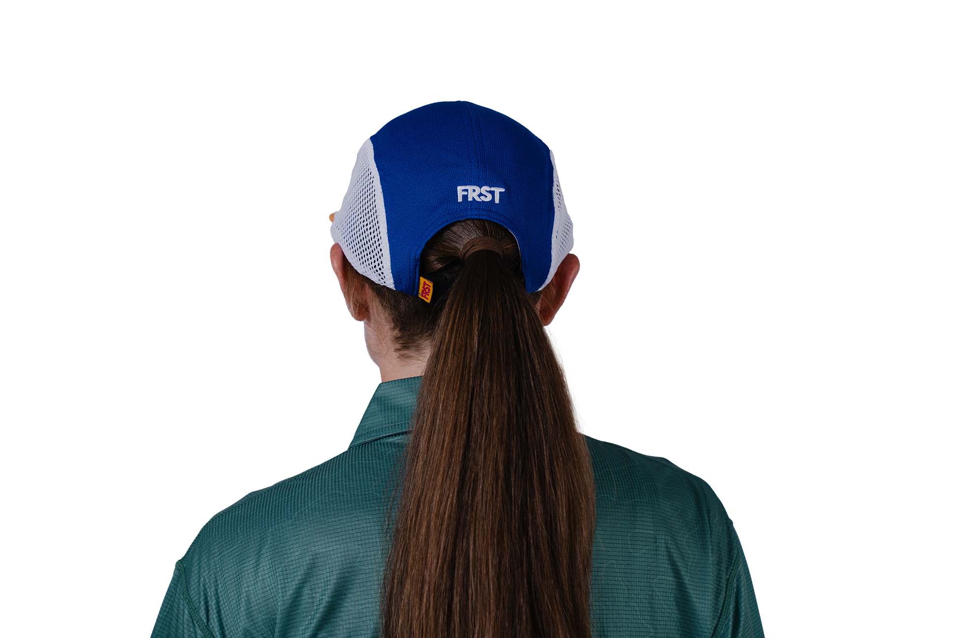 Person wearing a blue cap with 'FRST' logo on a white background