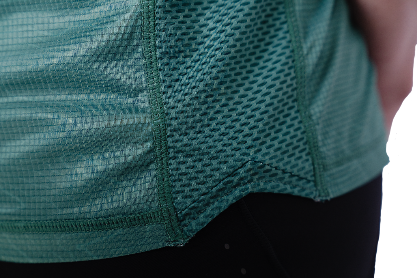 Close-up of a green athletic shirt with mesh design