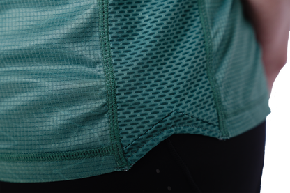 Close-up of a green athletic shirt with mesh design