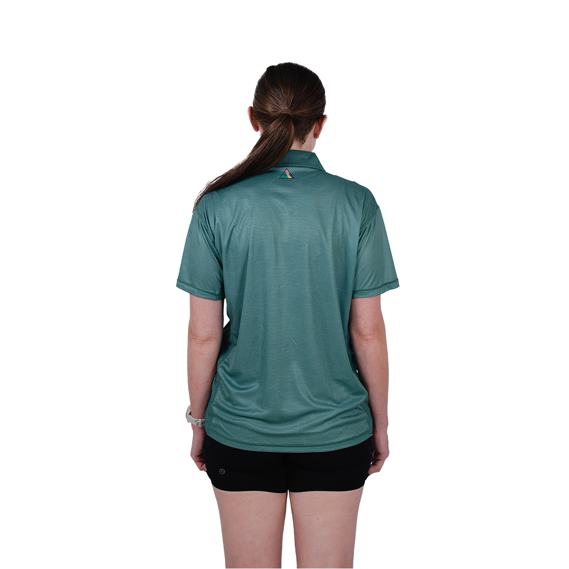 Person wearing a teal shirt on a white background