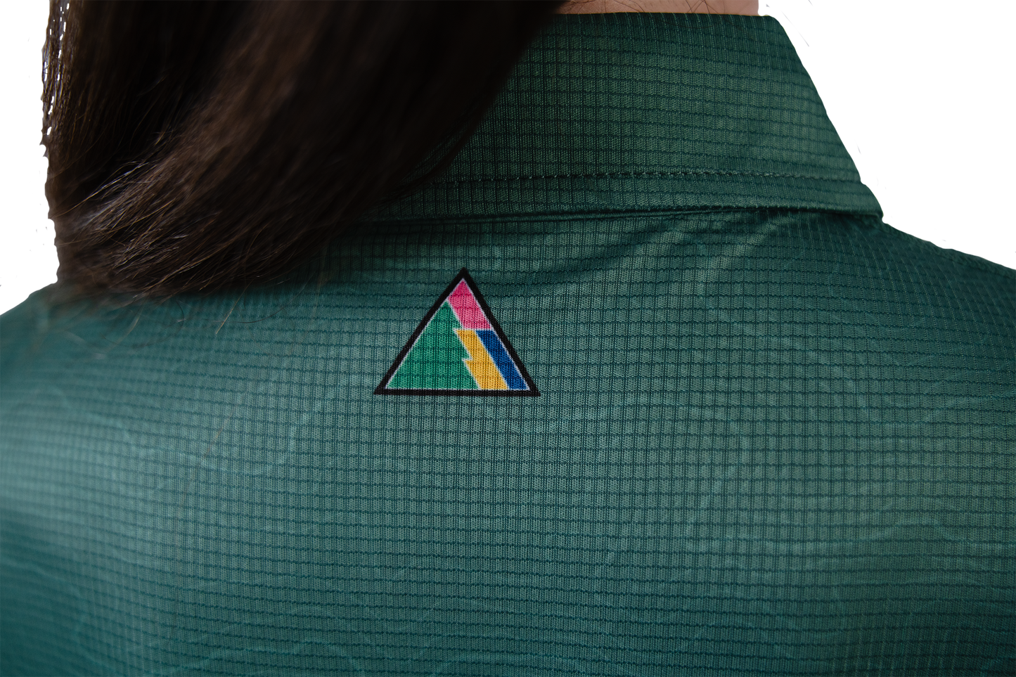 Green shirt with a colourful triangle FRST logo on the back
