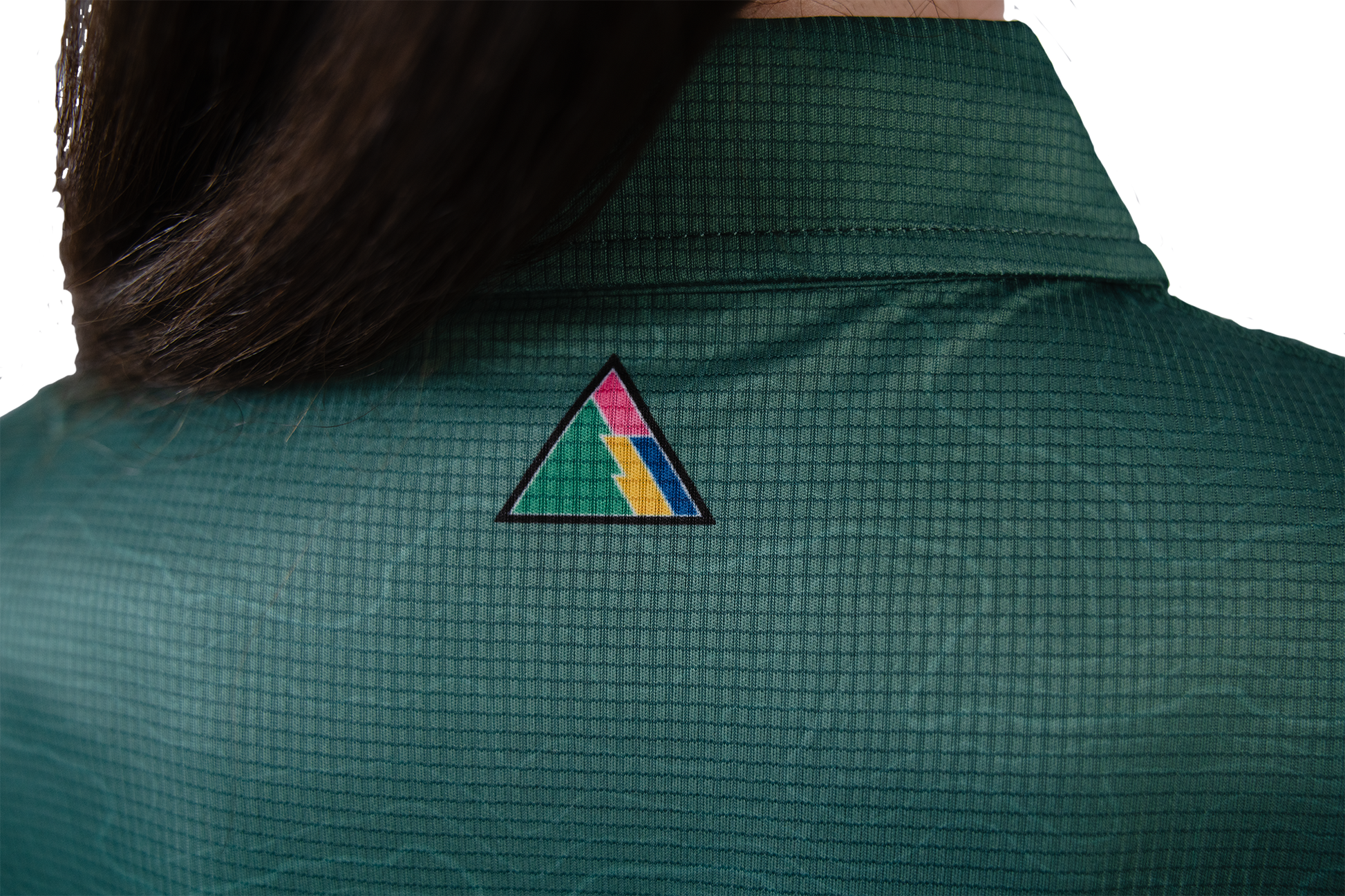 Green shirt with a colourful triangle FRST logo on the back