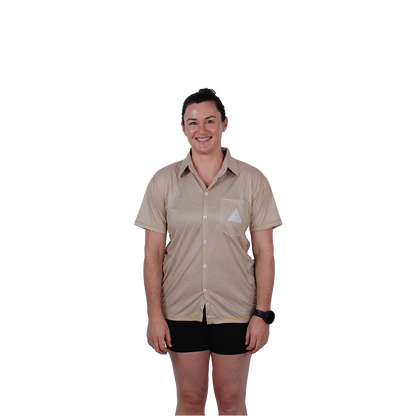 Person wearing a beige shirt and black shorts on a white background