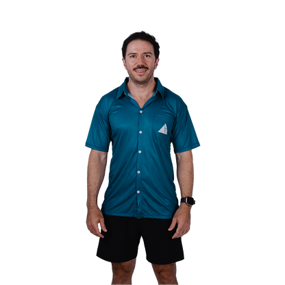 Man wearing a blue shirt with a white triangle FRST logo on a white background