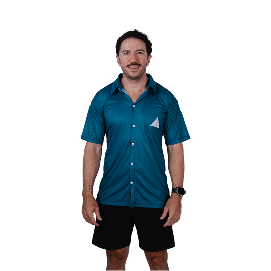 Man wearing a blue shirt with a white triangle FRST logo on a white background