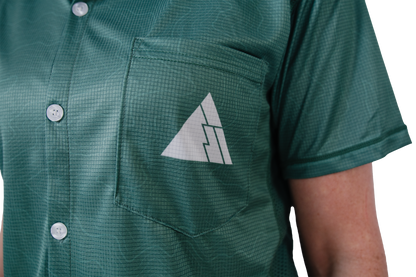 Green button-up shirt with a FRST logo on a white background